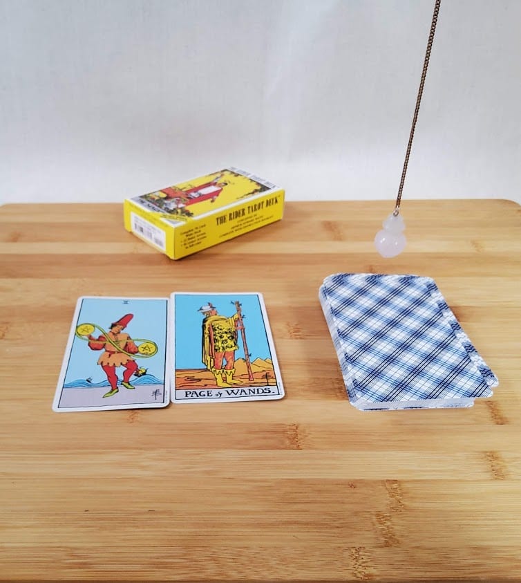 pendulum deciding the meaning of a tarot card