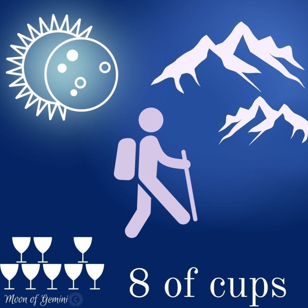 8 of cups tarot card with eclipse, hiker, mountains and 8 cups