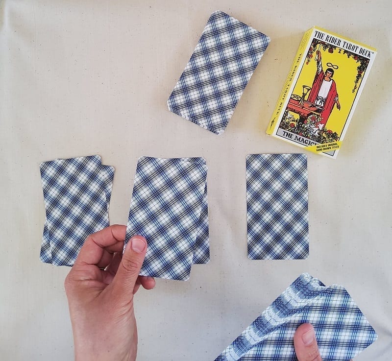 shuffling tarot cards into alternate decks