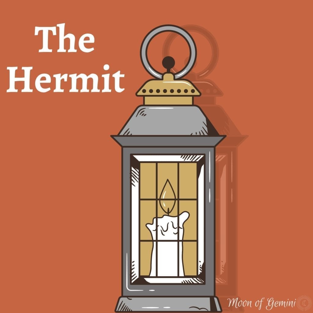 the hermit tarot card (a lit lantern)