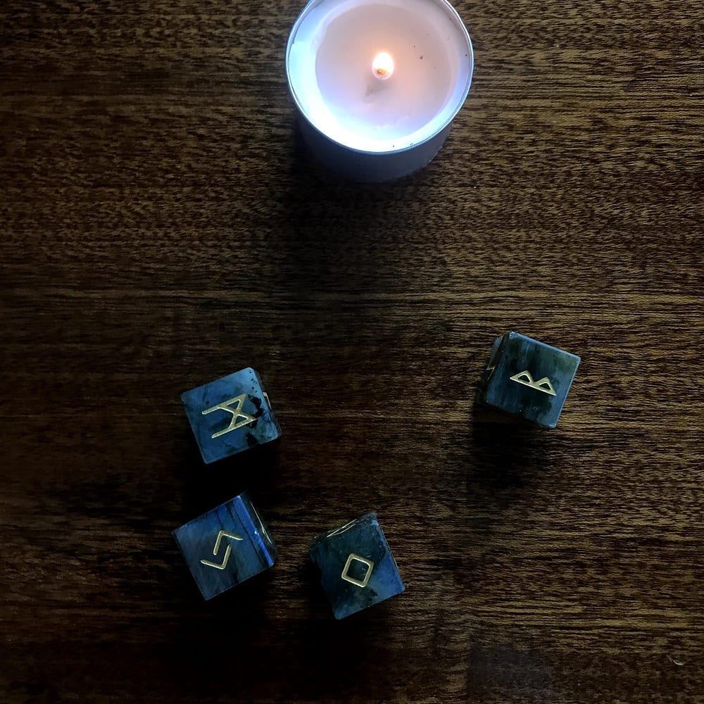 rune dice with candle