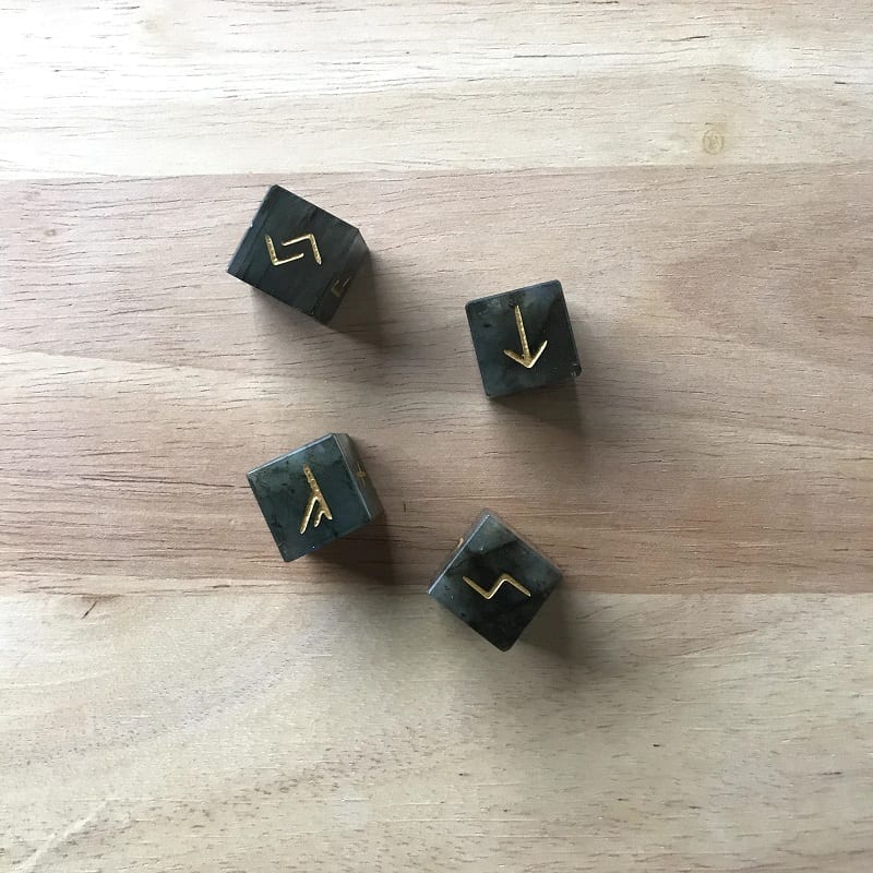 rune dice on wooden background