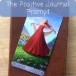 positive journal prompt sun tarot card on journal