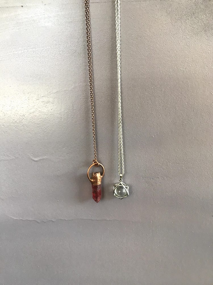 two pendulum necklaces